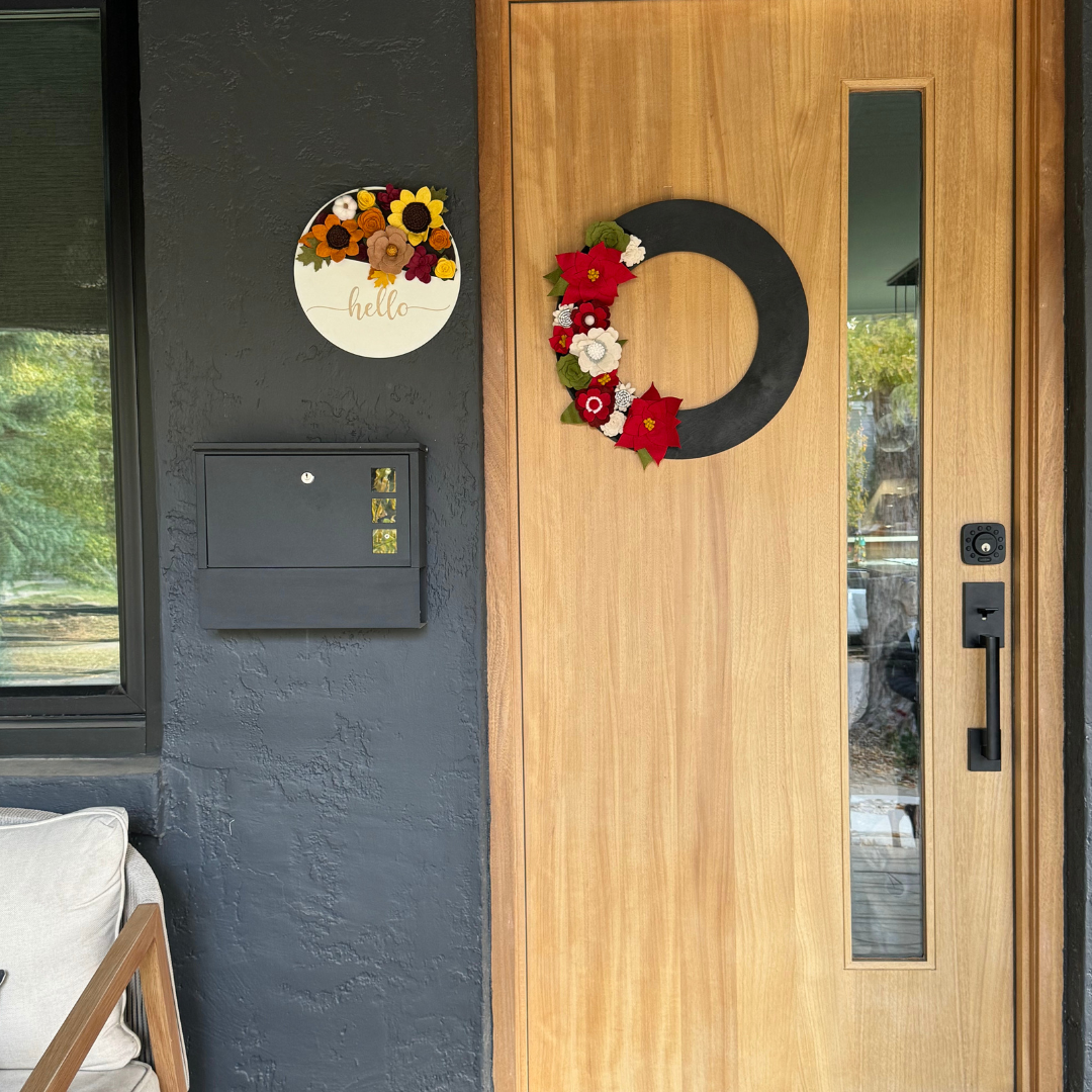 Celebrate the holiday season with the Swappable Christmas Wreath Attachment, a festive and versatile addition to your decor. This wreath is crafted from felt flowers and adorned with vibrant red poinsettias, offering a classic and elegant holiday touch.