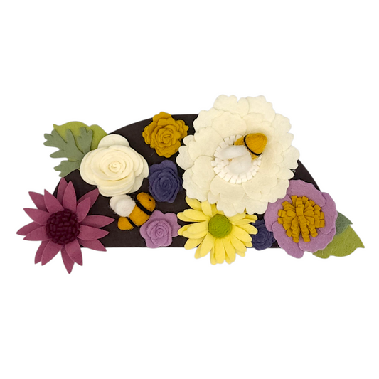 Wreath attachment with bumblebees and colorful flowers in purple, yellow, and linen on a brown background, supporting pollinator protection.