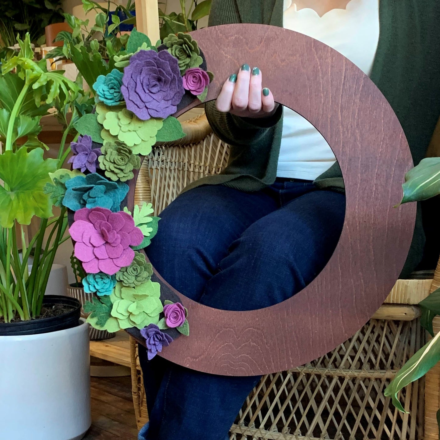 Bring vibrant, summery charm to your decor with the Summer Wreath Attachment, a beautifully designed accent piece perfect for any occasion. This wreath is adorned with a lush array of succulents in shades of teal, green, purple, and pink, all set against a rich brown background for a natural, earthy appeal. Made from high-quality, eco-friendly materials, it’s a reusable and sustainable alternative to traditional decor. Pair it with our merino wool felt bows for a cohesive, nature-inspired look.