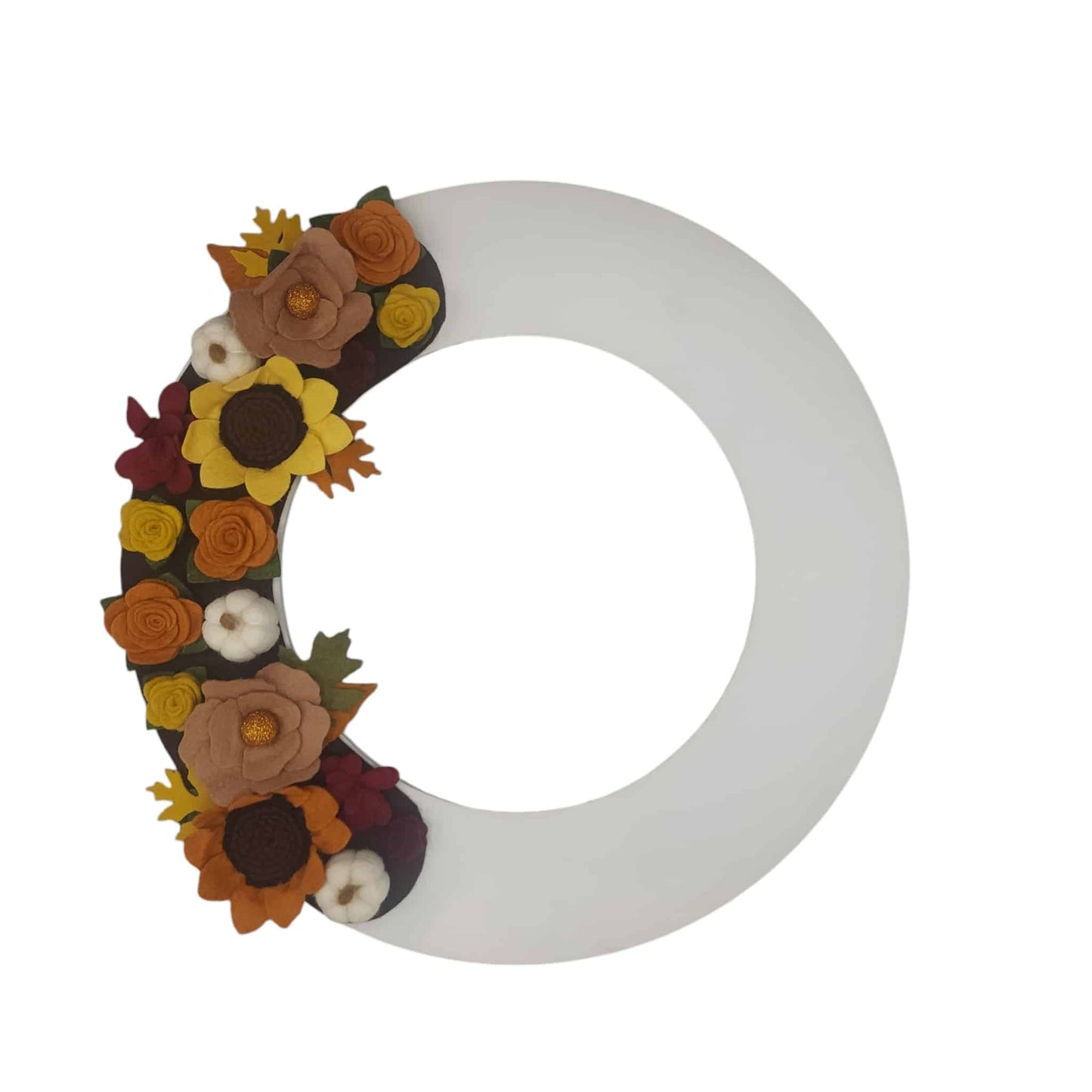 Sunflowers, pumpkins, and assorted autumn-hued flowers on a white wreath base giving a crisp clean look for fall.