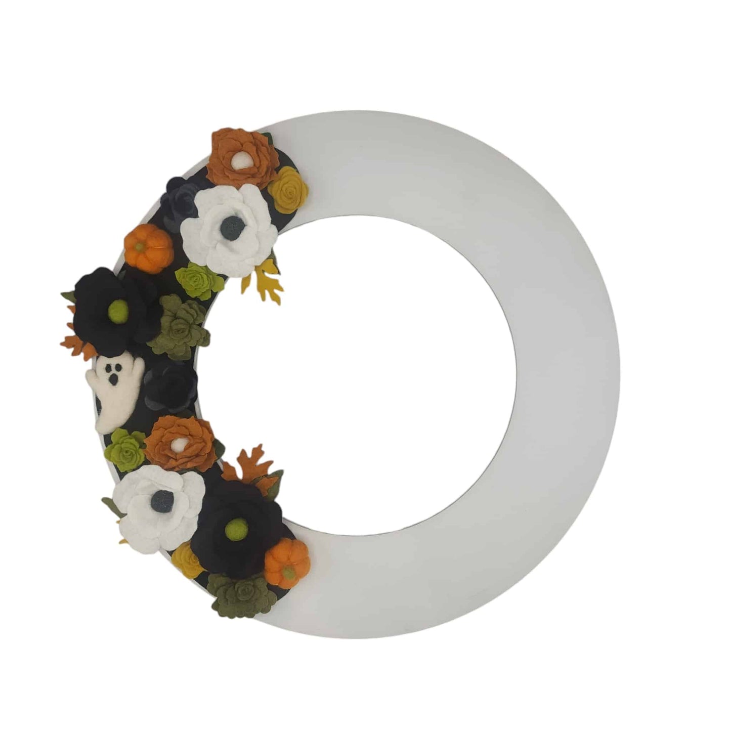A fun and sustainable decoration, this wreath combines seasonal colors and playful accents for a festive look.