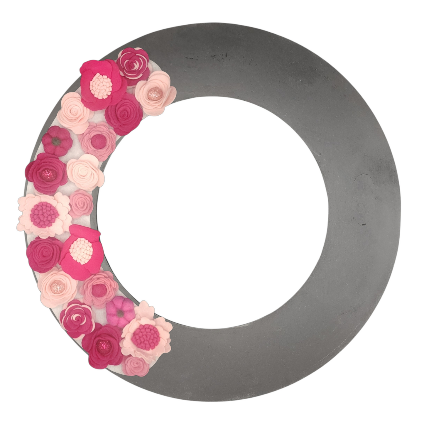 Limited Edition Eco-friendly wreath with shades of pink flowers, glitter balls and whimsical pink pumpkins shown on a black wreath base. October is Breast Cancer Awareness month - wear it pink!