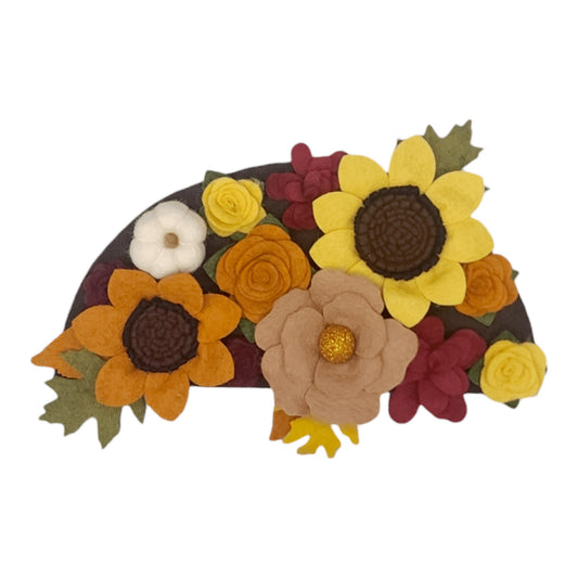 Autumn attachment shows vibrant felt flowers in autumn colors adorn with white felted pumpkins. Perfect for turkey season.