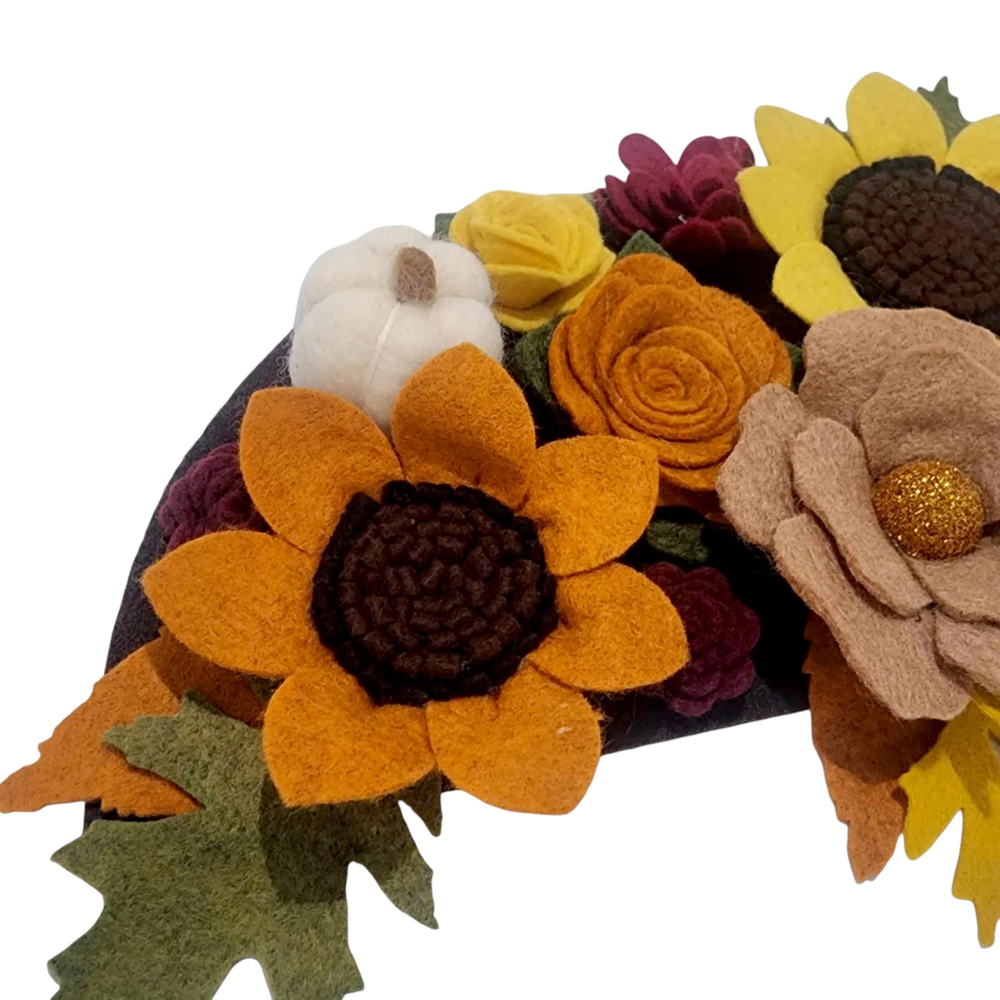 Autumn attachment closeup shows vibrant felt flowers in autumn colors adorn with white felted pumpkins. Perfect for Thanksgiving.