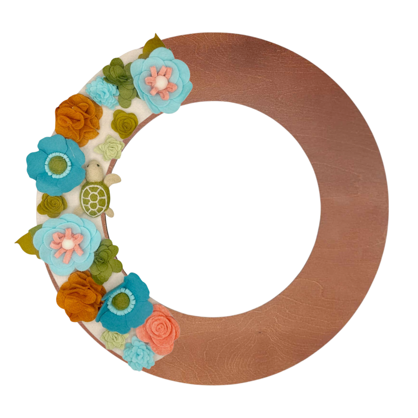 An eco-friendly wreath supporting the "Save the Sea Turtles" cause, featuring bright teal, blue, green, and orange felt flowers on a tan background featured on the walnut wreath base.