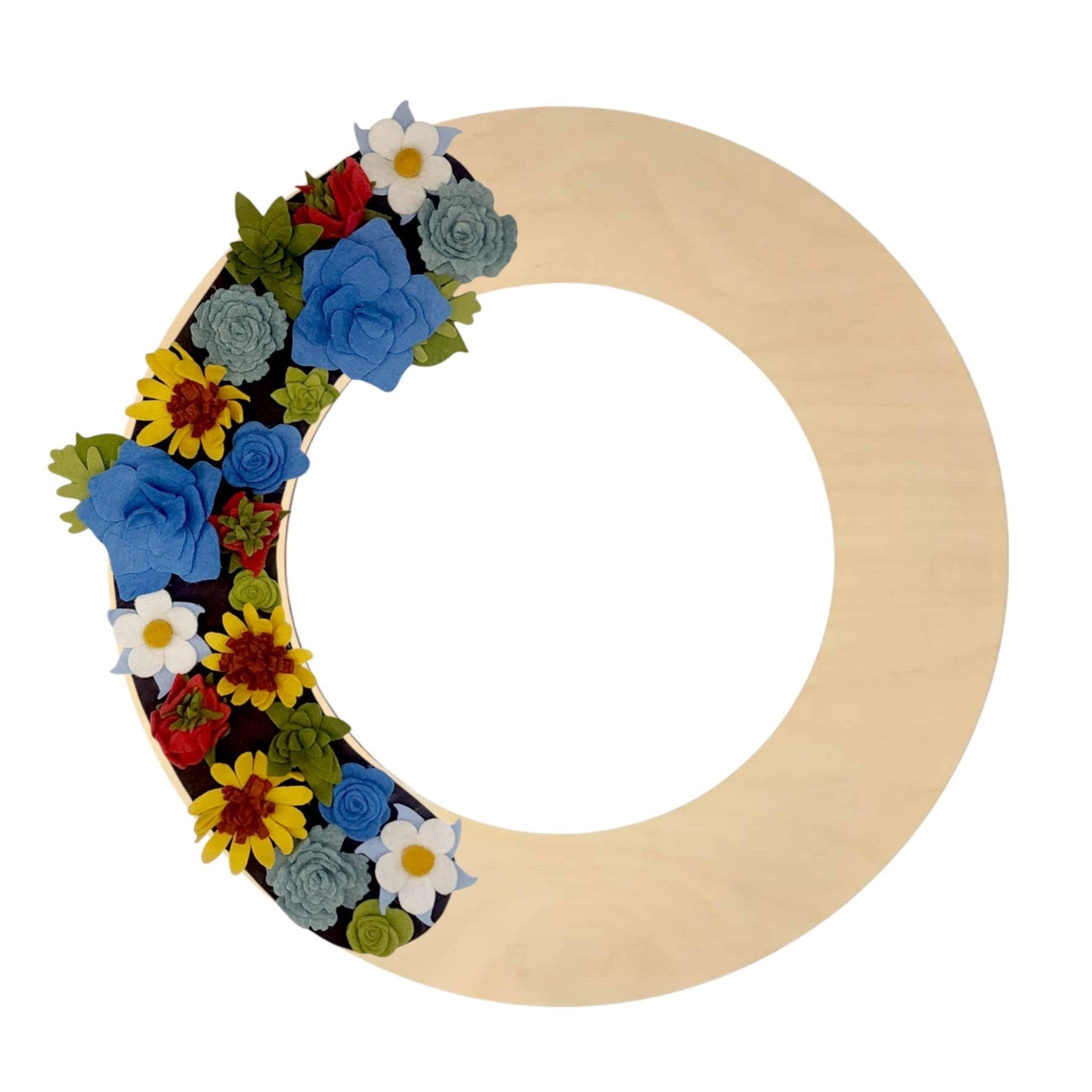 A colorful wreath of Colorado wildflowers, including columbines and sunflowers, arranged on a birch base with greenery accents.