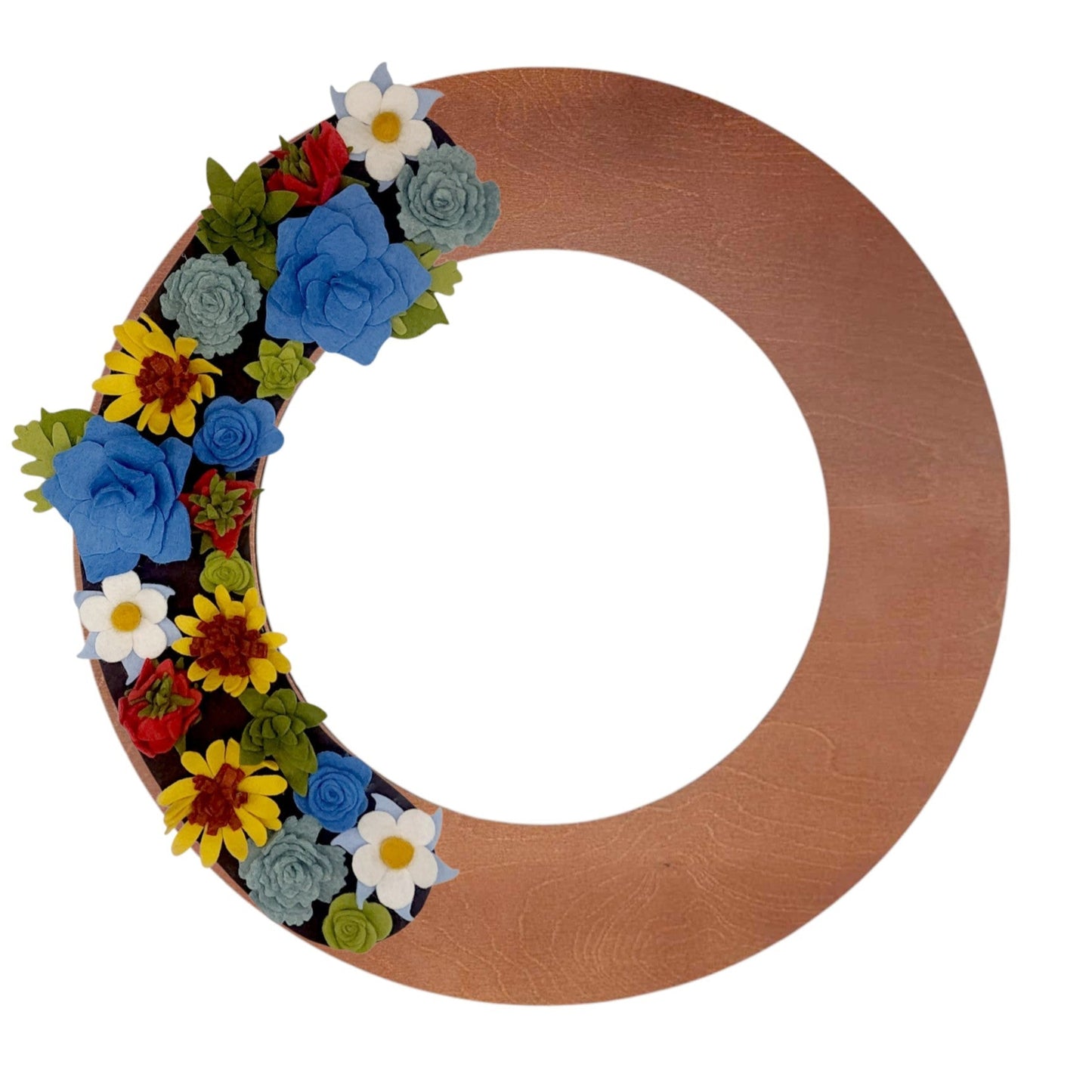 An array of Colorado wildflowers, such as blue columbines, bright sunflowers, and delicate asters, arranged on a walnut wreath base.