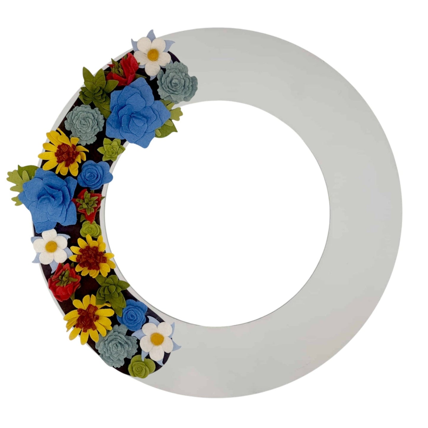 An array of Colorado wildflowers, such as blue columbines, bright sunflowers, and delicate asters, arranged on a white wreath base.