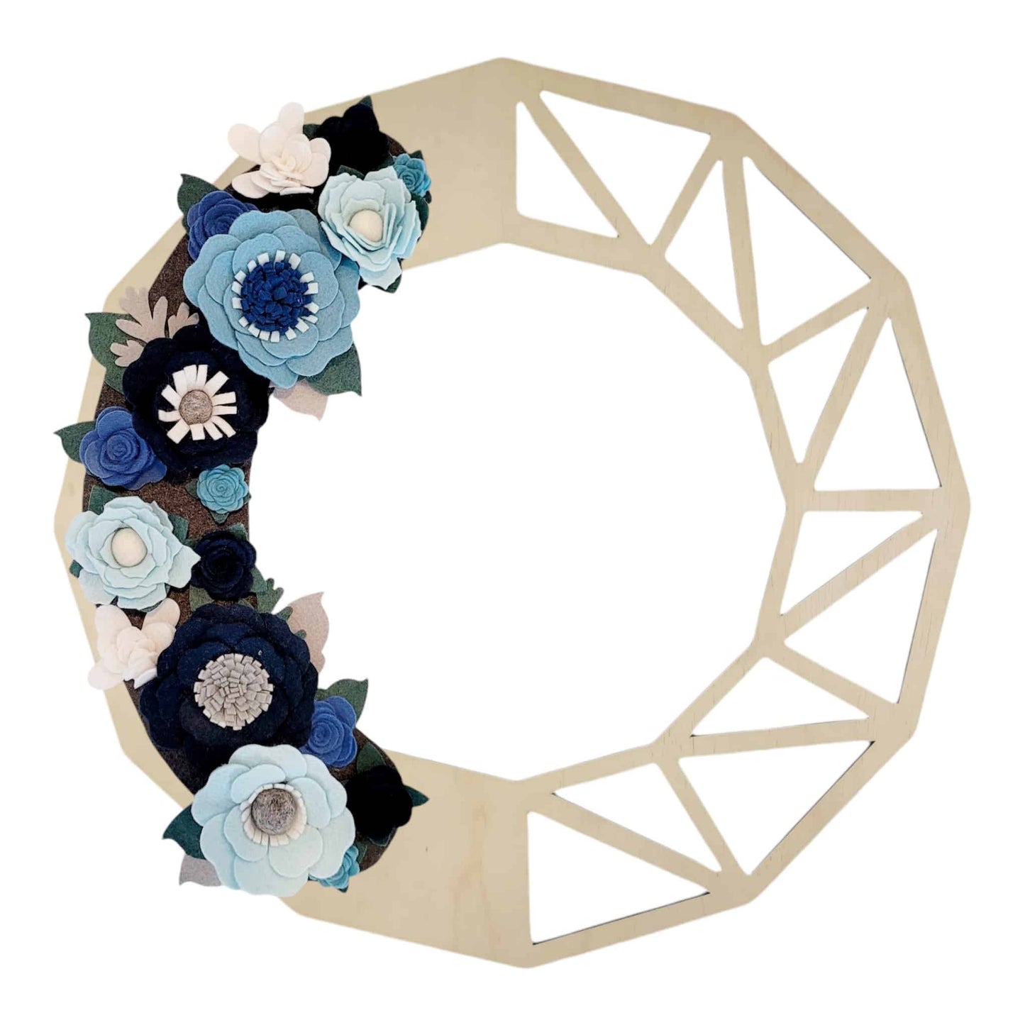 Introducing the "Winter | Standard Wreath Attachment": A wooden wreath featuring a striking geometric design on the top right, paired with handcrafted Eco-Fi felt flowers in an array of blue, white, and grey shades adorning the bottom left. The meticulously handmade flowers boast a variety of petal shapes and sizes, imparting texture and depth to this exquisite wreath.