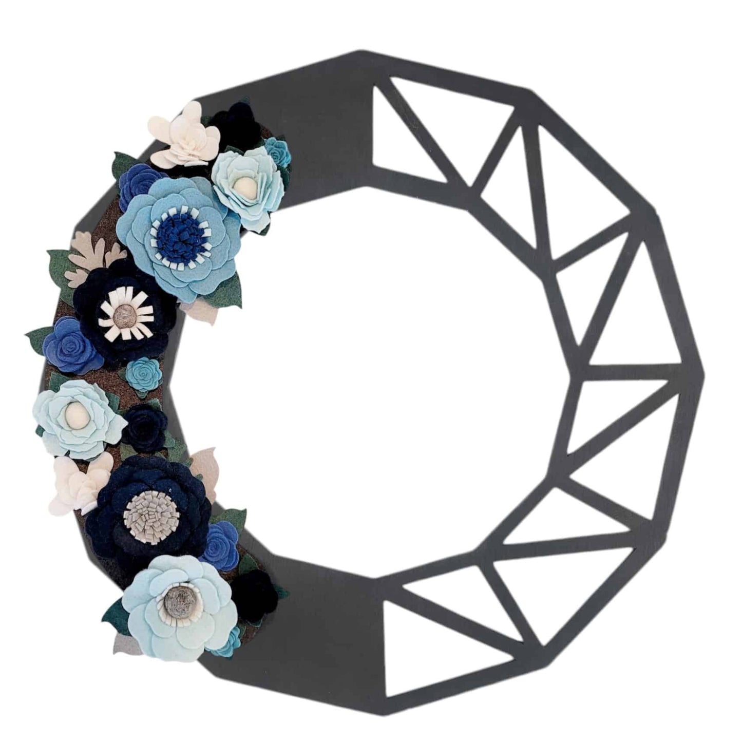 This image showcases the Winter | Standard Wreath Attachment, featuring a black geometric wireframe structure. The left half is adorned with handmade felt flowers in shades of blue, white, and teal, crafted from Eco-Fi felt, with silver accents creating a visually appealing contrast against the minimalist wireframe.