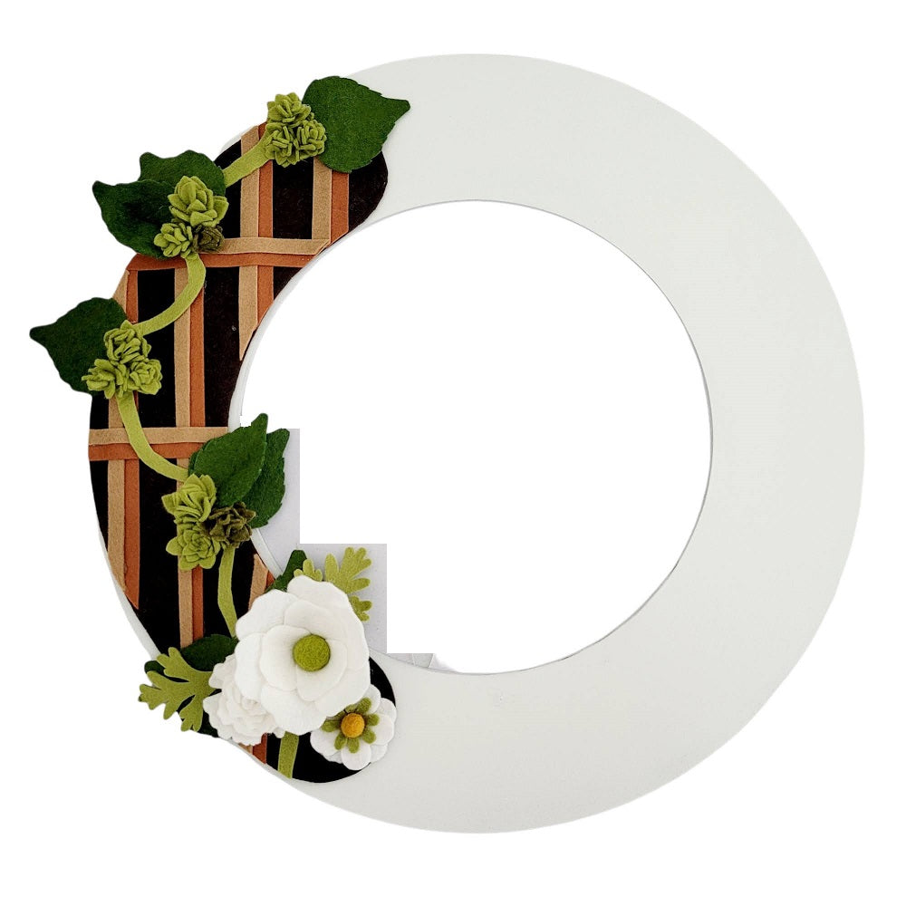 An eco-friendly door wreath with a felt trellis design featuring lush faux beer hops vines on a white wreath base.