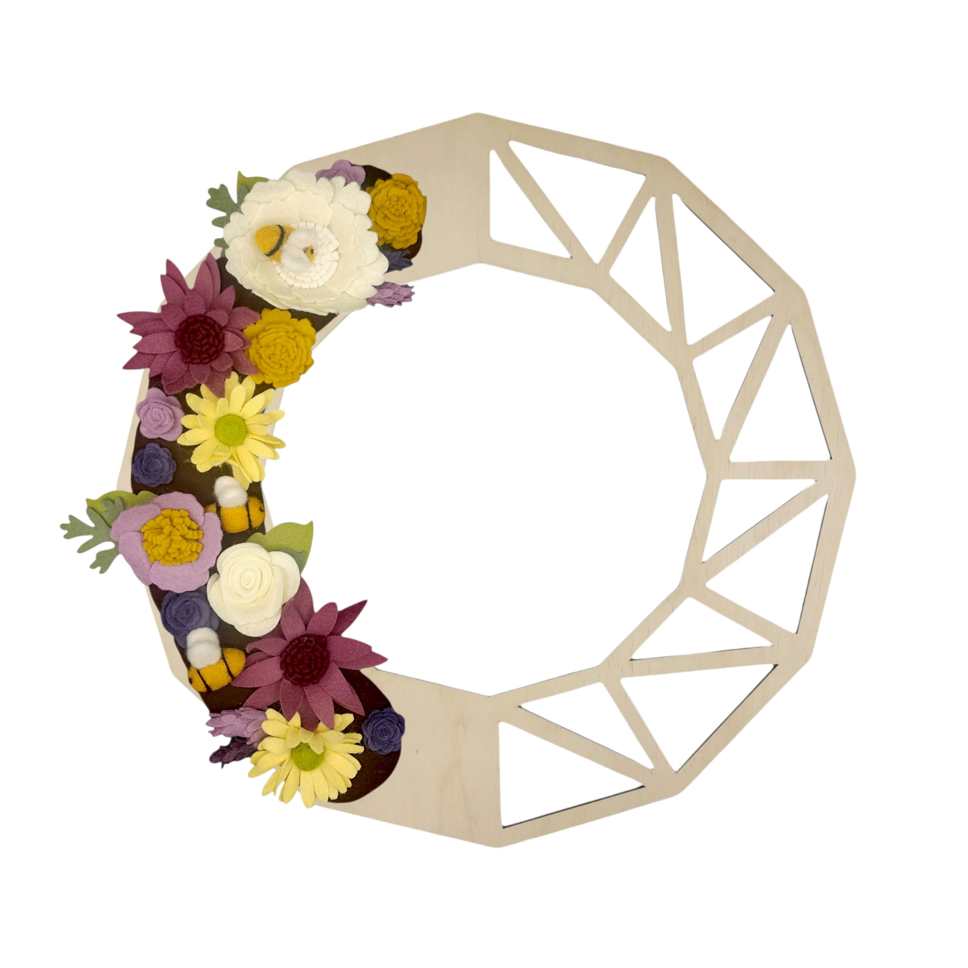 This charming wreath promotes the "Save the Bees" movement, featuring delightful felt bees buzzing among vibrant purple and yellow flowers on a birch geometric base.