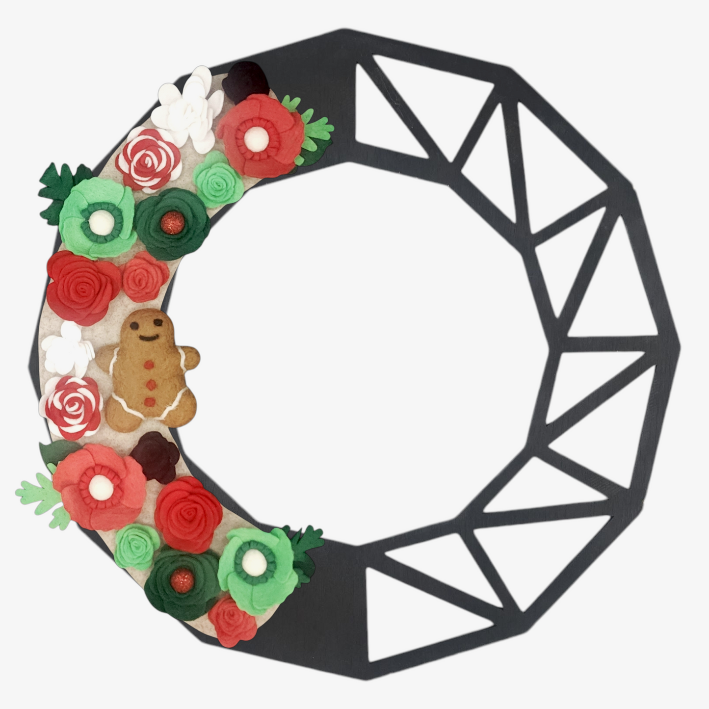 Whimsical gingerbread decor holiday wreath with eco-conscious design, featuring candy cane-like red and white flowers, vibrant blooms, and a gingerbread ornament on a beige background on a geometric wreath