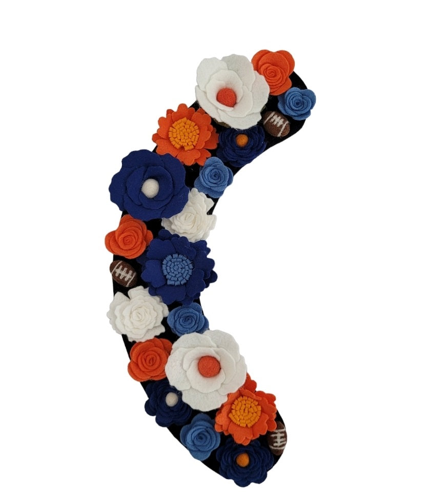 A festive door wreath for football season, featuring vibrant orange and blue felt flowers. Perfect for Florida Gators football!