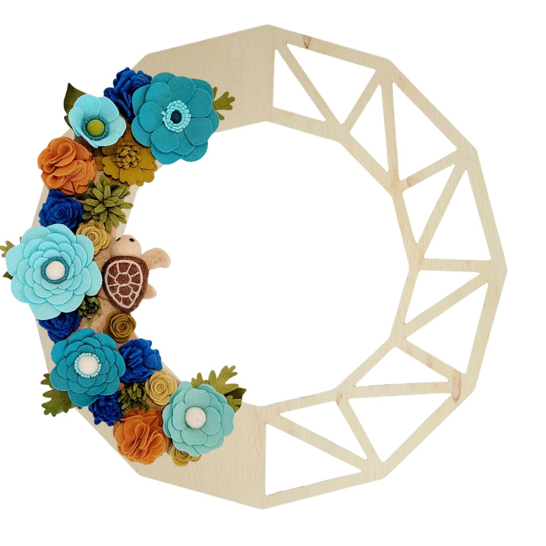 This wreath beautifies your door while raising awareness for the protection of sea turtles and their environment. Shown on the birch geometric wreath base.