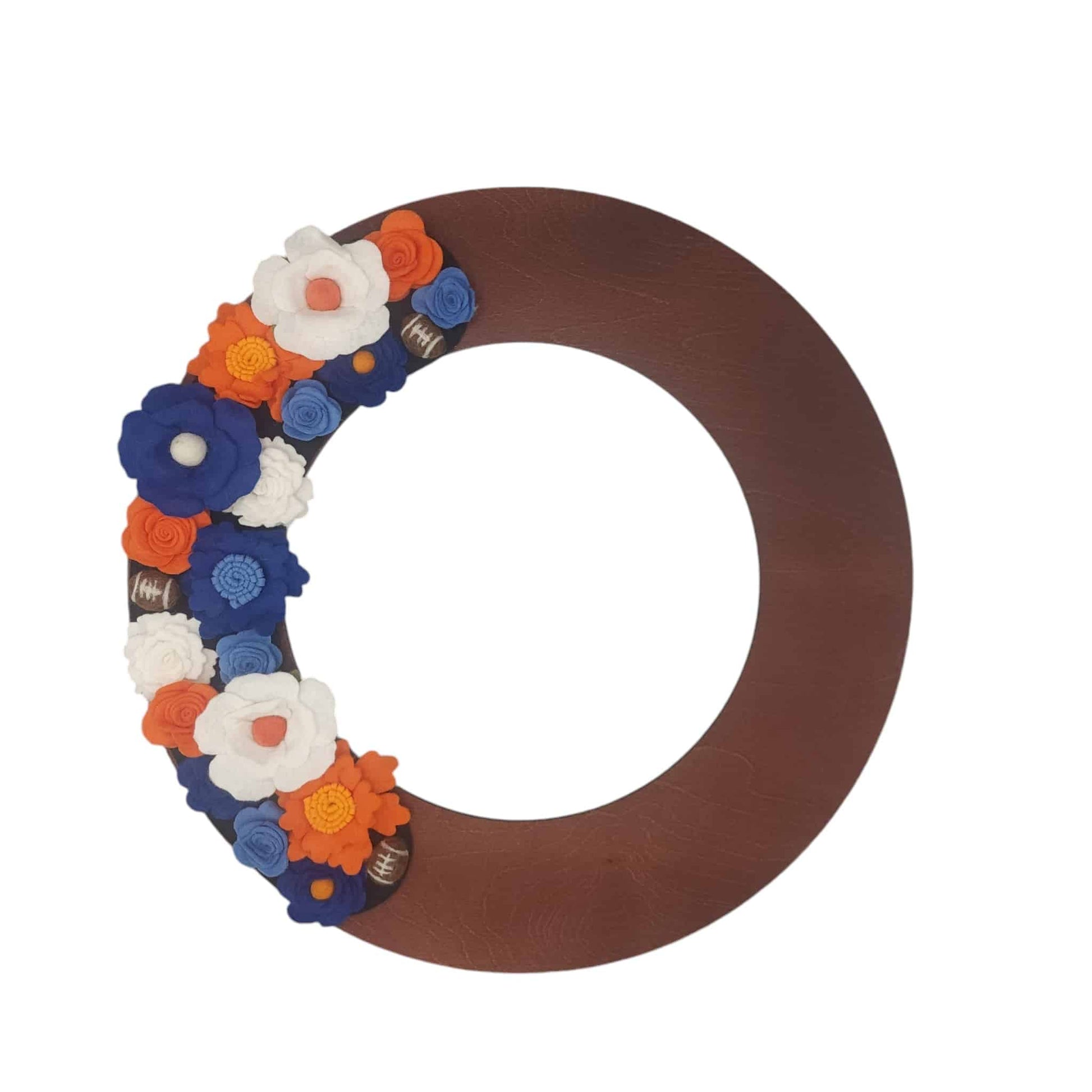 This wreath captures the excitement of game day and is ideal for showing team spirit at any entrance! Mini felt footballs and sport colors orange and blue felt flowers.