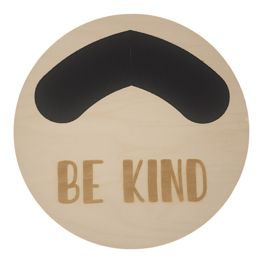 11" circular wreath base in color birch with "BE KIND" laser etched below velcro for attachments.