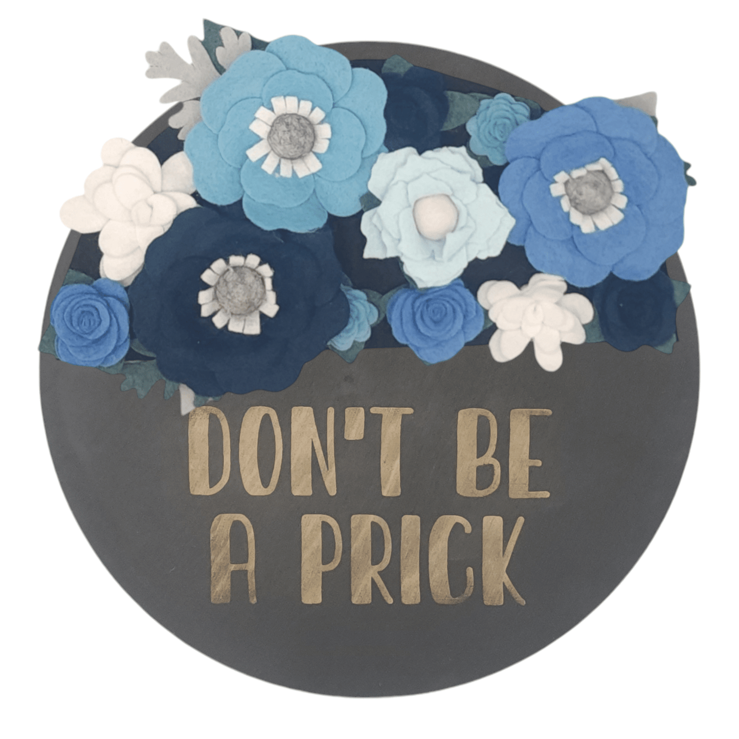 Winter wreath is a winter wonderland of blue and white felt flowers on a round black base reading "DON'T BE A PRICK".