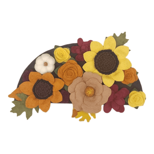 Autumn attachement shows vibrant felt flowers in autumn colors adorn with white felted pumpkins. Perfect for turkey season.