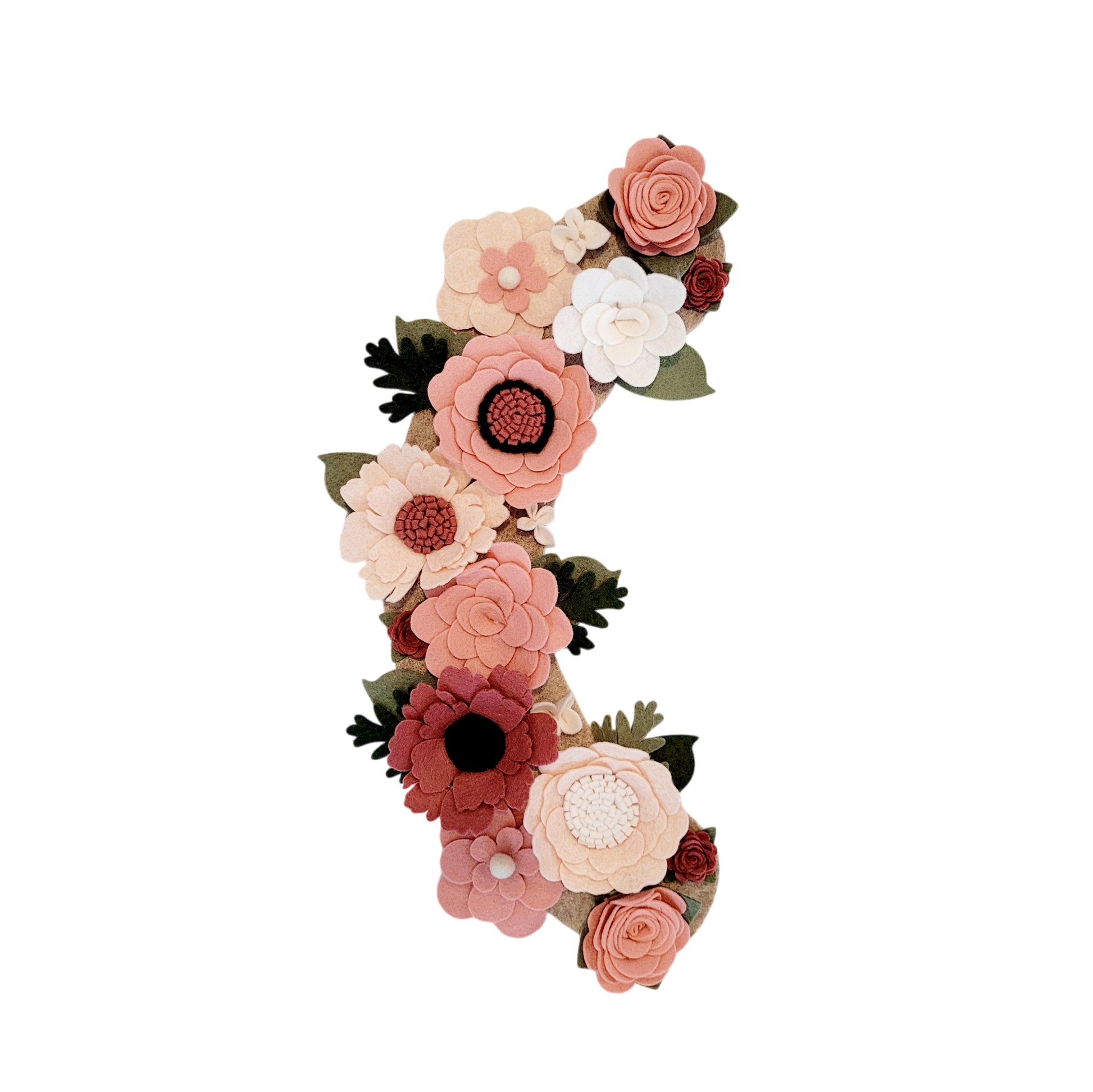 Interchangeable spring wreath is full of pink, blush, and linen flowers on a beige background. 