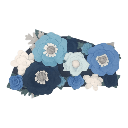 The winter wreath showcasing the blue and white felt flowers with silver accents.