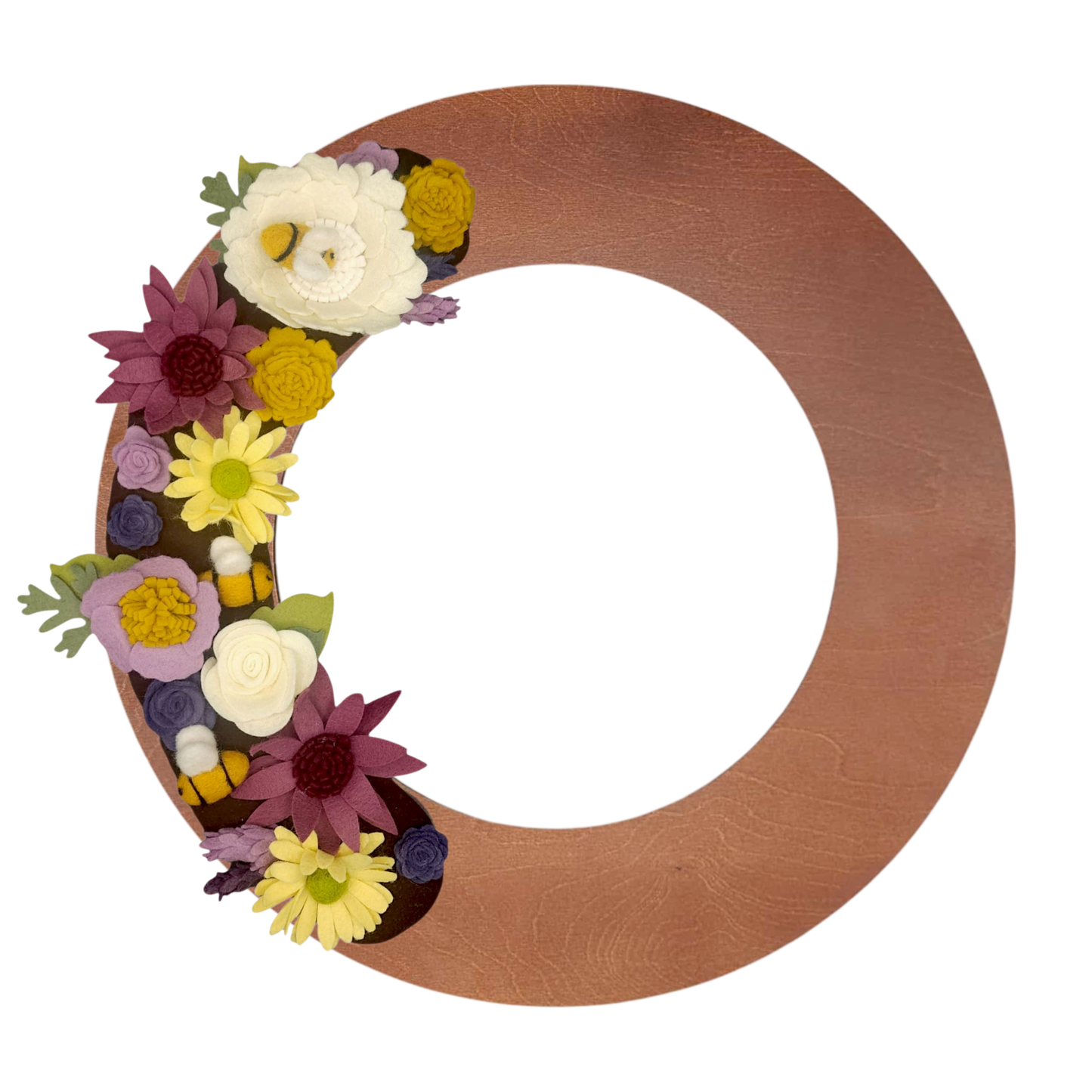 The colorful felt blooms are arranged on a walnut base, accented with lush greenery, emphasizing sustainability.