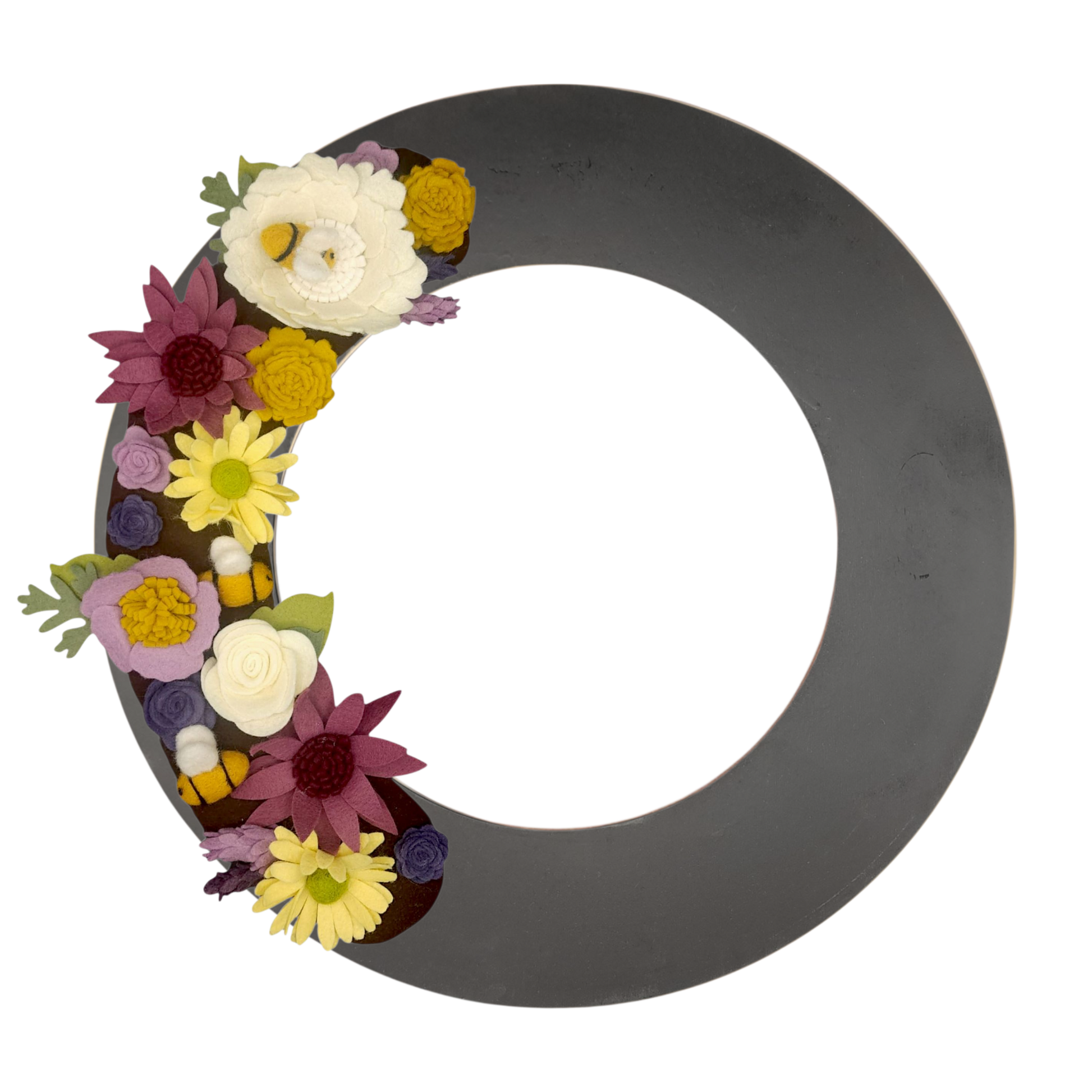 A whimsical wreath featuring felt bees among vibrant purple and yellow flowers contrasting on the black wreath base.