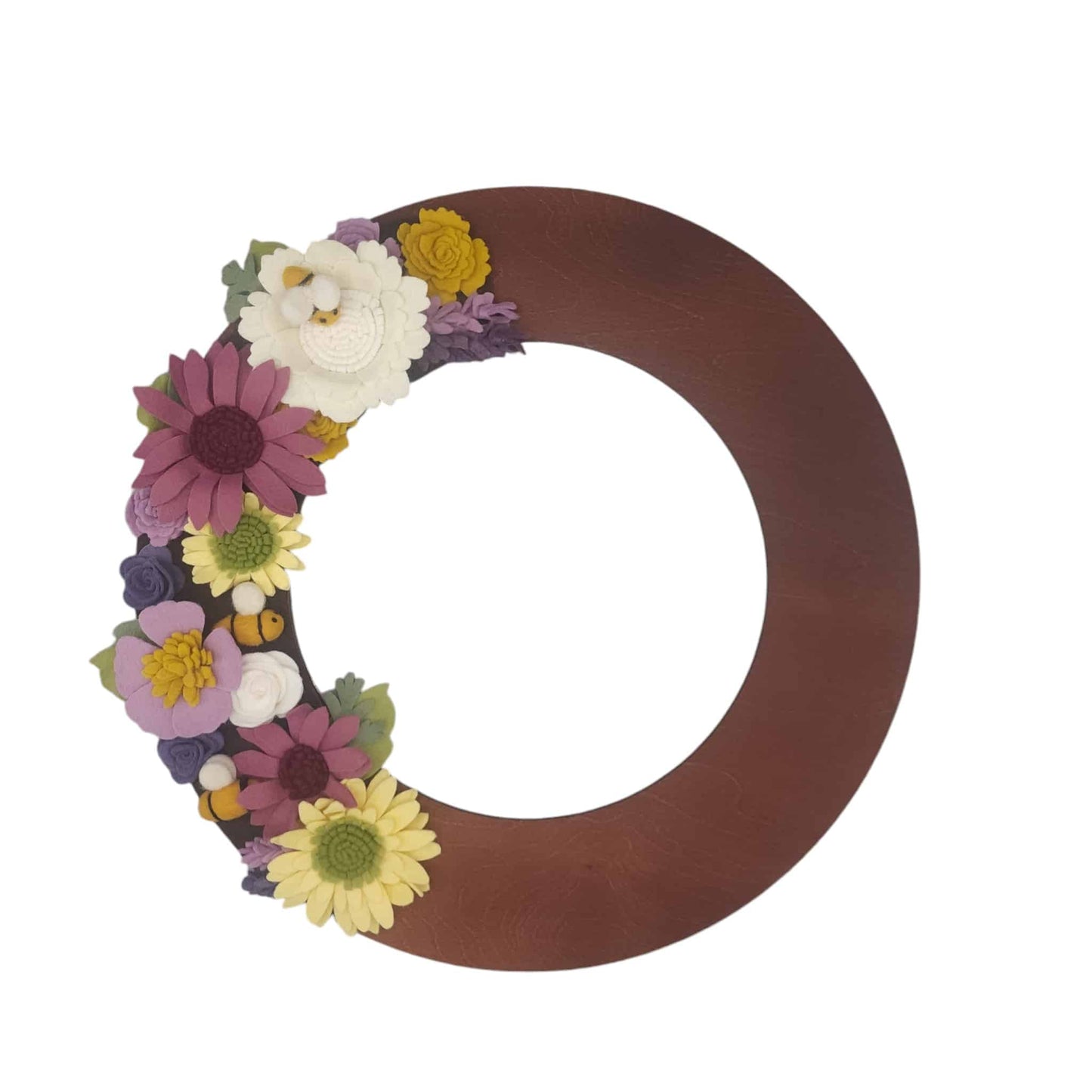 The colorful felt blooms are arranged on a walnut base, accented with lush greenery, emphasizing sustainability.