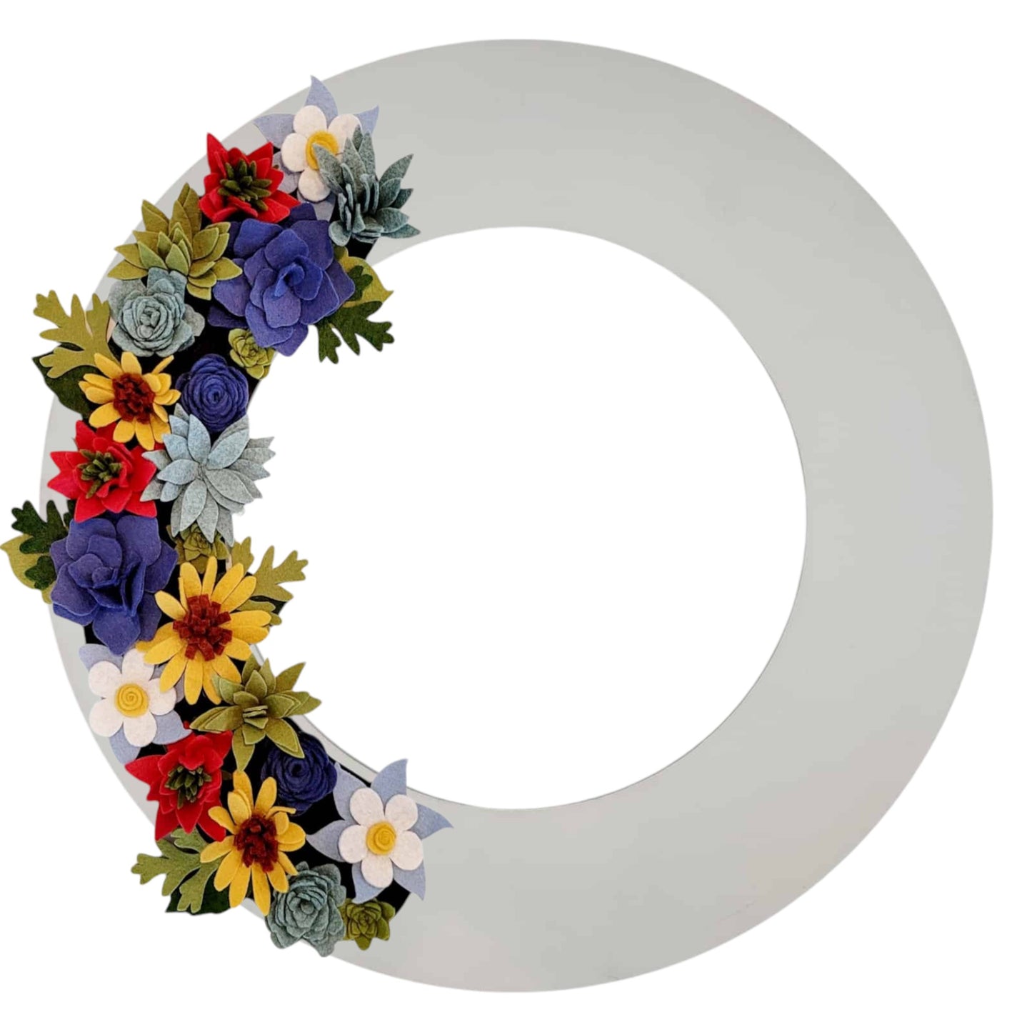 An array of Colorado wildflowers, such as blue columbines, bright sunflowers, and delicate asters, arranged on a white wreath base.